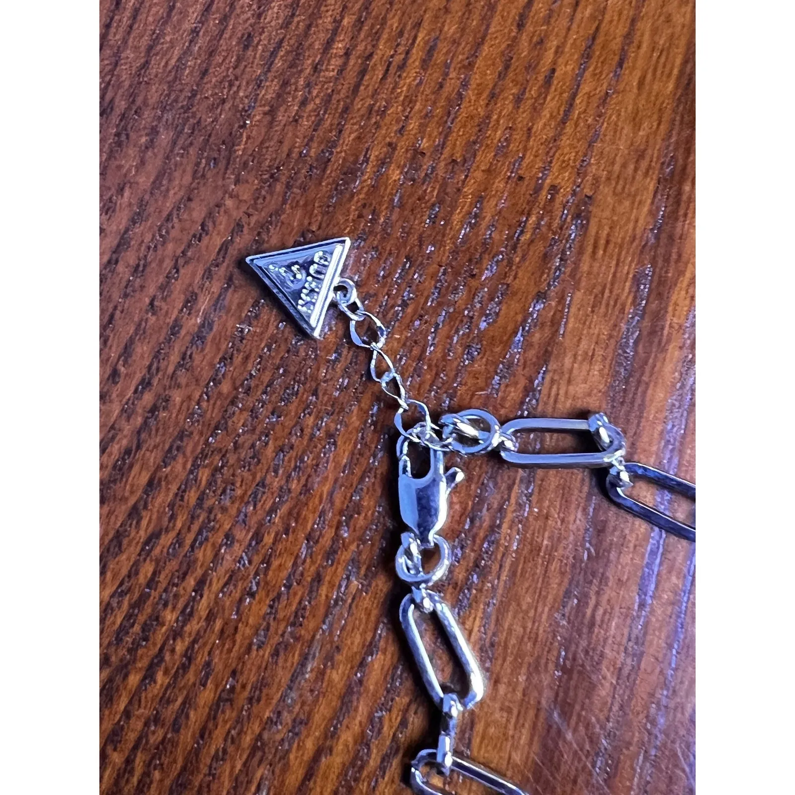 Guess Silver Chain Bracelet with Rhinestone‎ Charm and Logo Triangle - Image 3