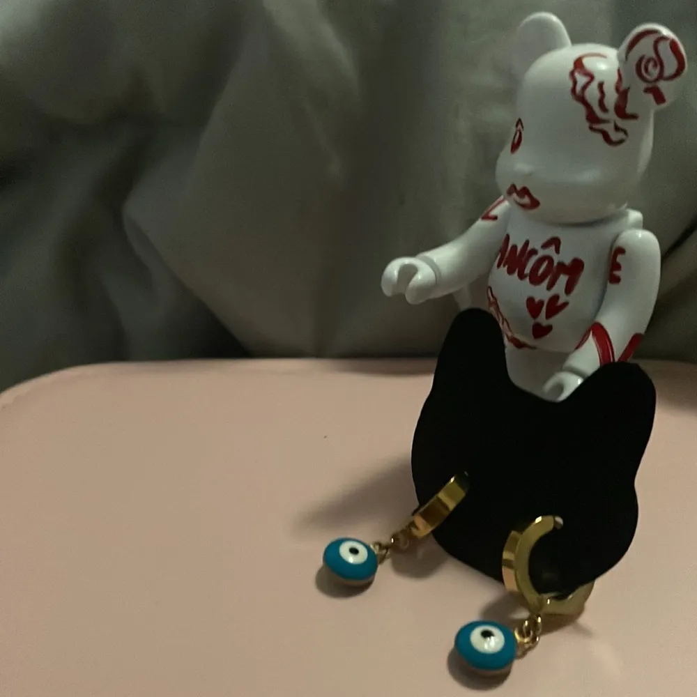 Evil eye Gold Huggies earrings - Image 6