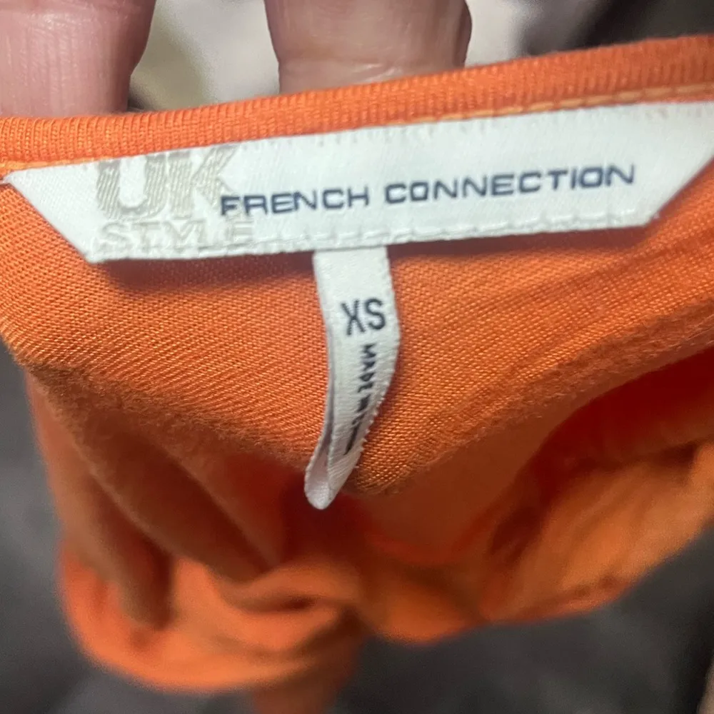 Orange Sleeveless Top with Cinched Waist and Ruched Shoulders - Image 2