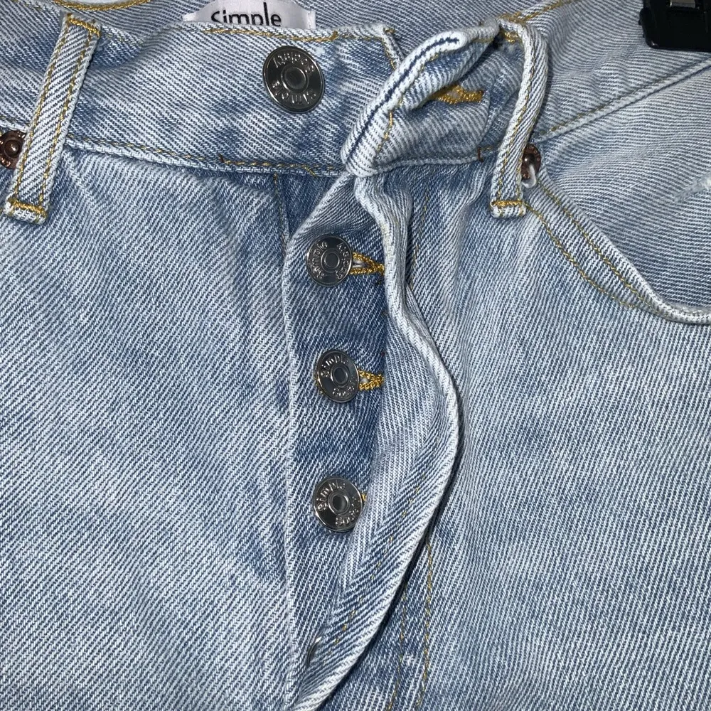 Simple Society Light Wash Blue Fringe Distressed Ripped Button Fly Jean Shorts 7 - Image 3