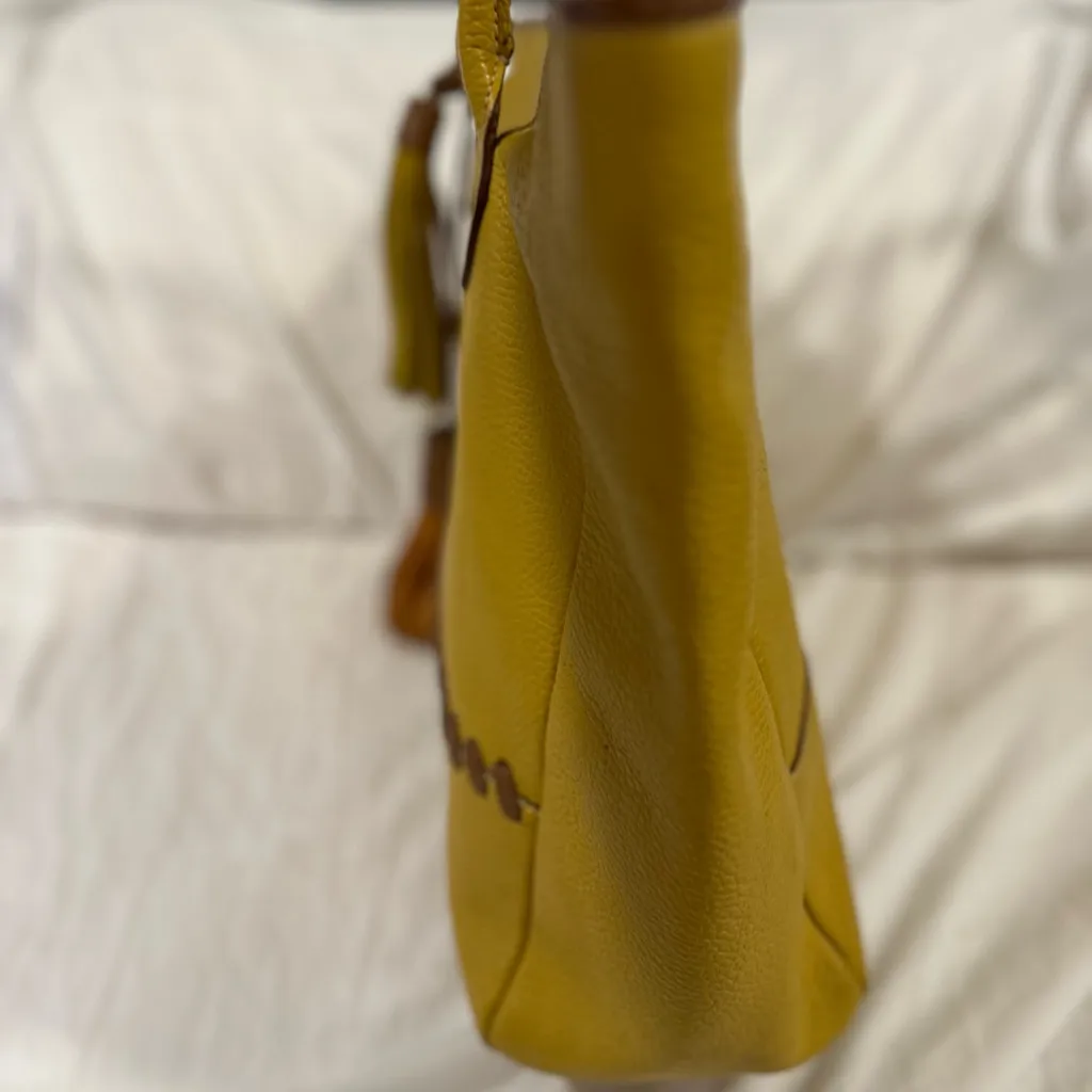 Sundance yellow pebbled vegan leather tote Bag with brown stitching and tassels. - Image 6
