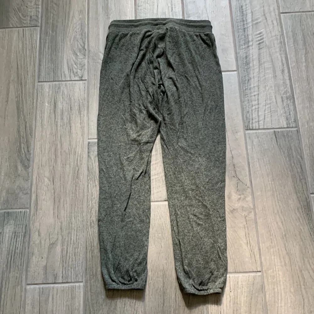 Out from under green jogger pants - Image 4