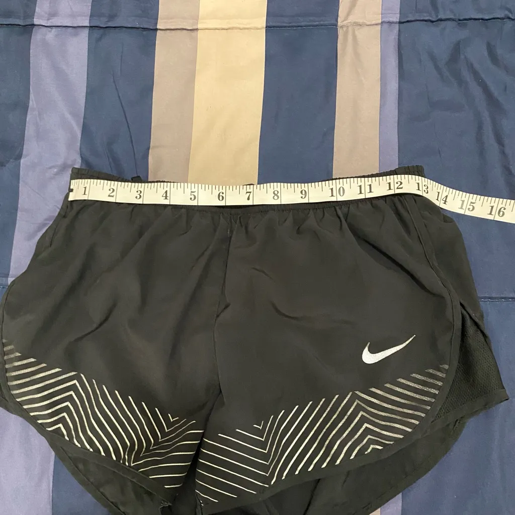 Nike Women's Black Athletic Shorts with Silver Accents - Image 4