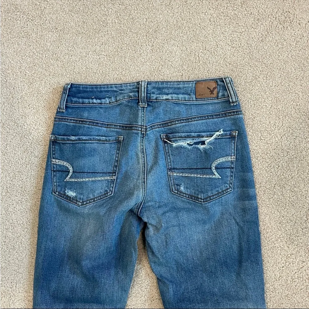 American eagle Tom girl button front distressed blue jeans in size 0 - Image 5