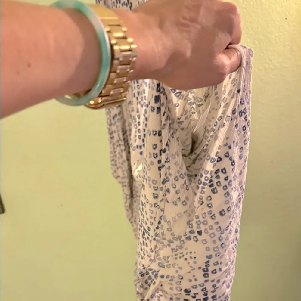 Romper with flowy pants and a crochet detail at chest. Gently worn, no damage. - Image 2