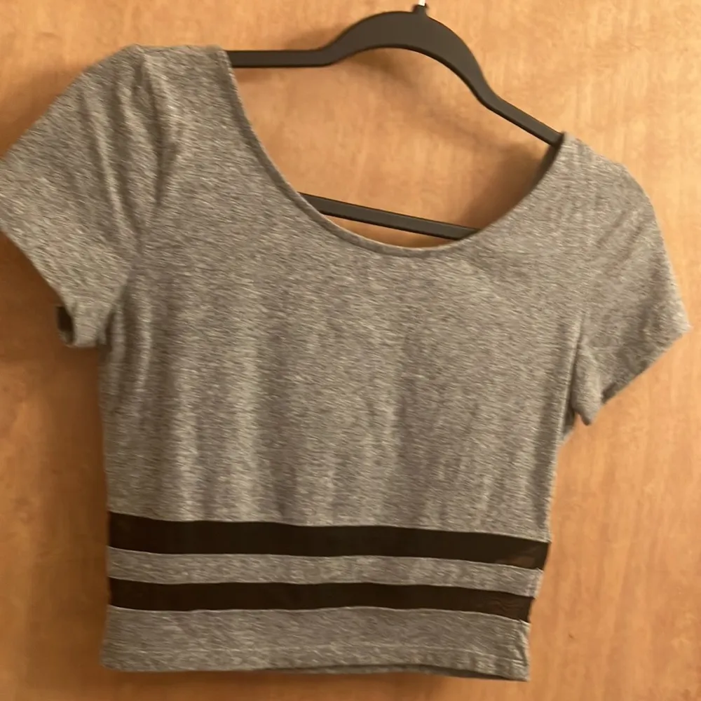 Grey short sleeve cropped top with sheer black stripes at the bottom size small - Image 4