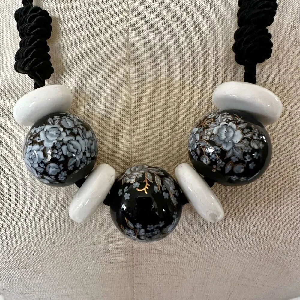 Black floral and white beaded necklace on black cord - Image 4