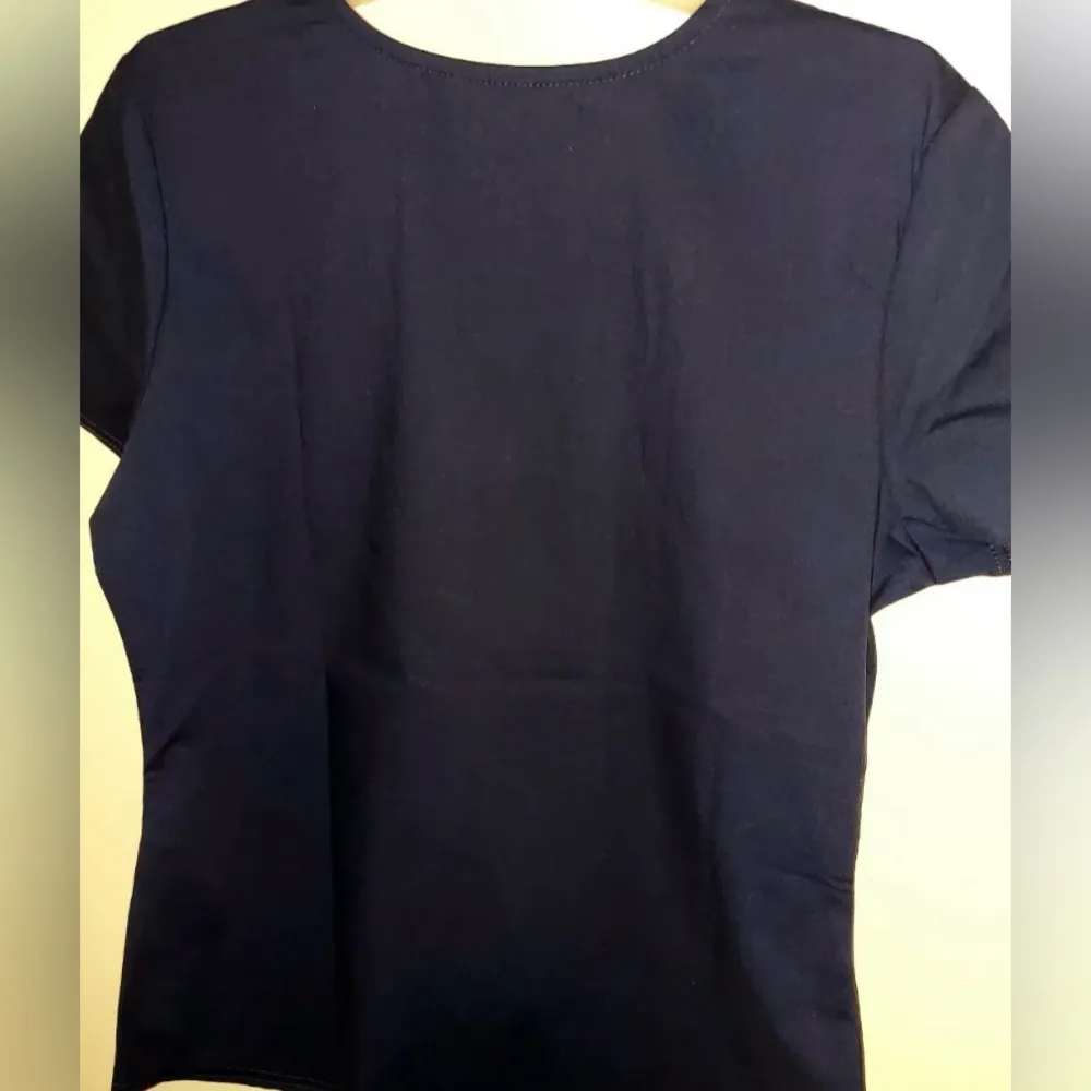 SCRUBSTAR Women Scrub Top Navy Blue With Orange Trim Around Neck And 2 Pockets - Image 4