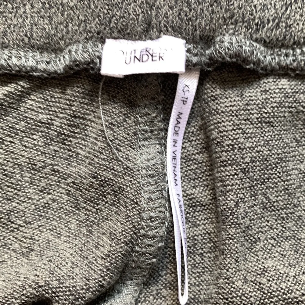 Out from under green jogger pants - Image 3