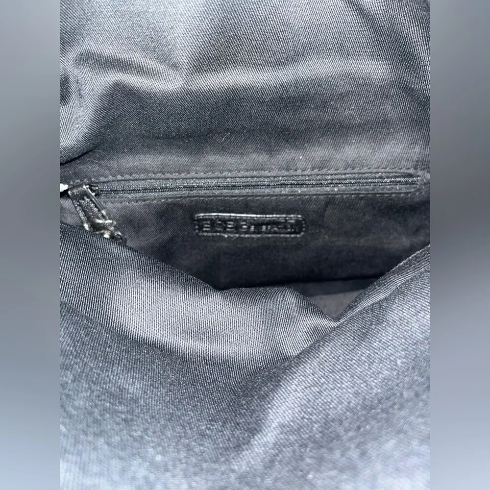 BCBGmaxazria White Glossy Sequined Styled Lazy Clutch in Animal Print Background - Image 11