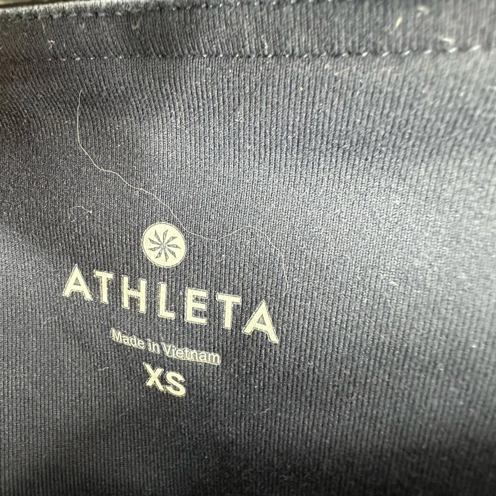 Athleta size‎ XS dark blue 3/4 length leggings with geometric pattern down legs - Image 4