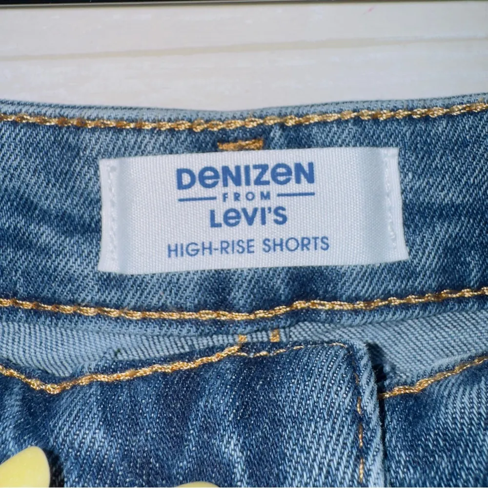 Denizen from Levi's Women's Medium Wash Blue High Rise Cut Off Distressed Shorts - Image 4