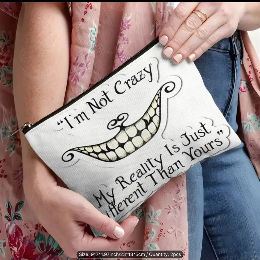 Afun attitude makeup bag with the words "I'm not crazy, my reality is different White - Image 3