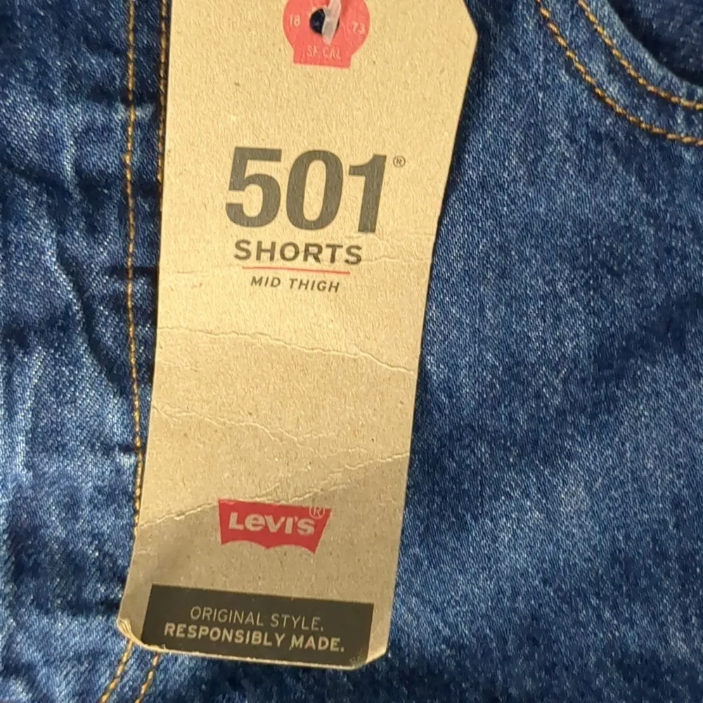 Levi's mid thigh high rise raw hem jean shorts size 33 - Image 3