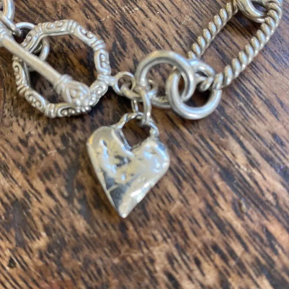 Detailed sterling silver chunky bracelet with a rustic heart - Image 2