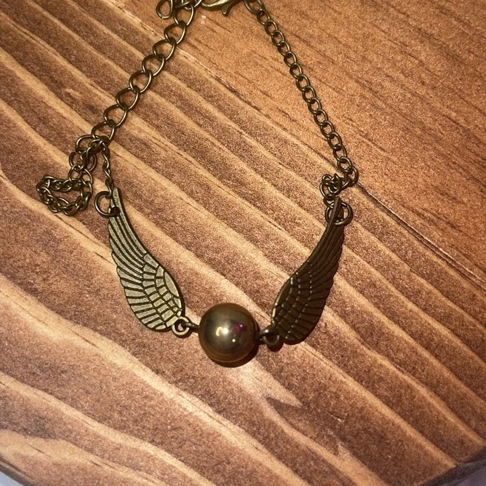 golden snitch bracelet
Any questions just let us know - Image 2