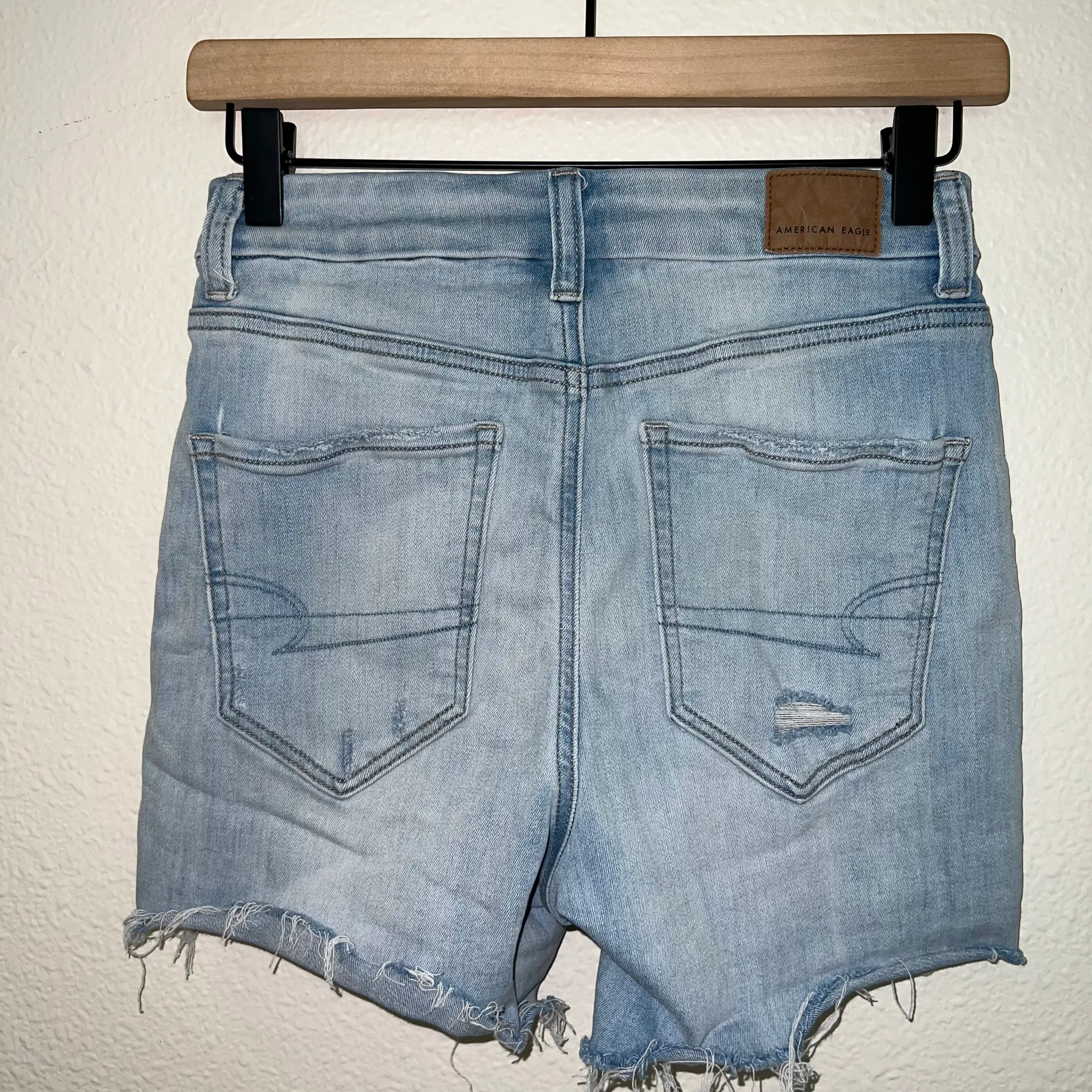 AE Distressed Next Level Stretch Curvy Hi Rise Shortie Shorts - Image 4