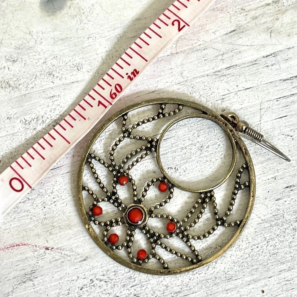 Brass tone circle earrings with floral pattern - Image 3