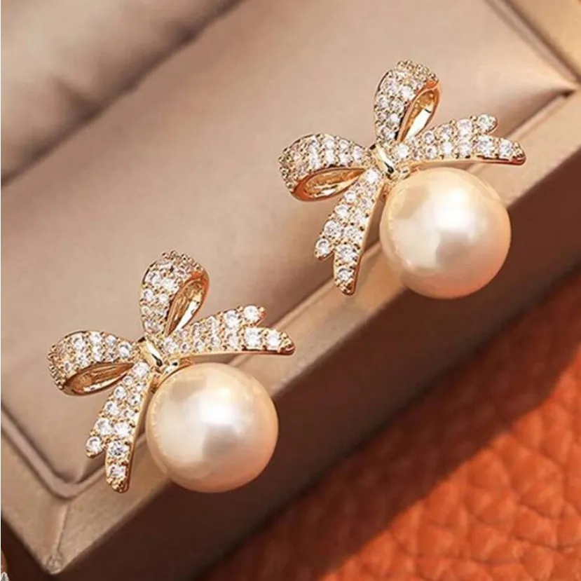 Gold and Pearl Bow Earrings - Image 2