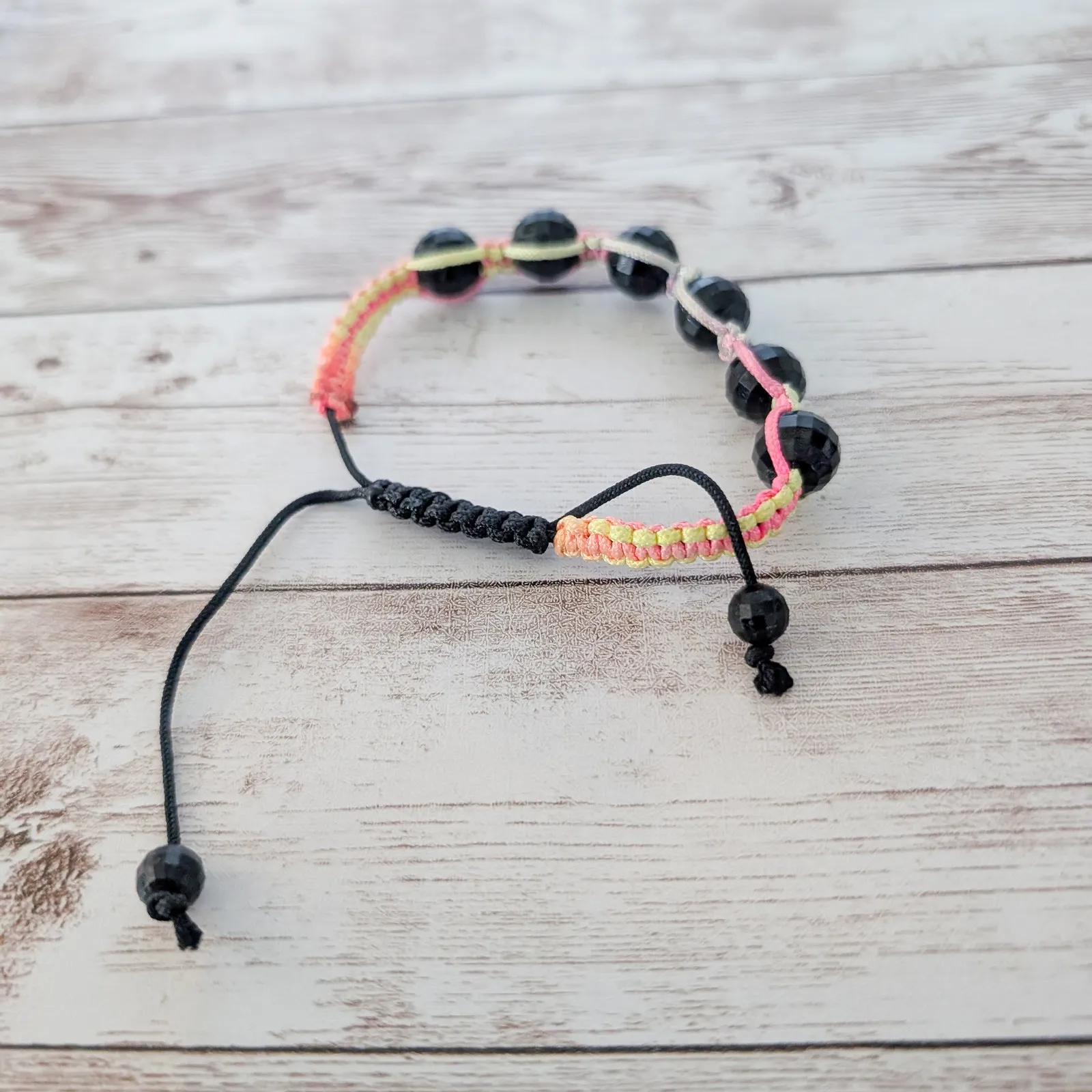 Multi Colored Cord Bracelet with Black Wrapped Beads - Image 3