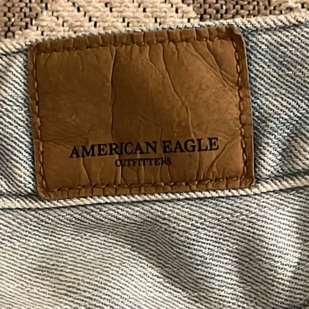 American Eagle Outfitters distressed light wash mini denim skirt - Image 12