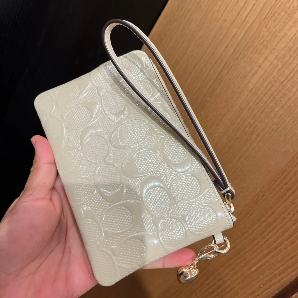 Coach Corner Zip Wristlet In Signature
Leather With Heart Charm - Image 4