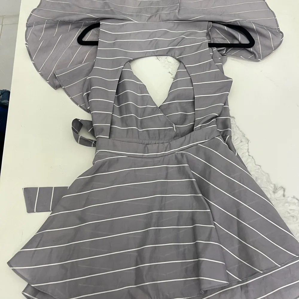 Balance Collection Gray Striped Romper wrap front V neck. - Image 4