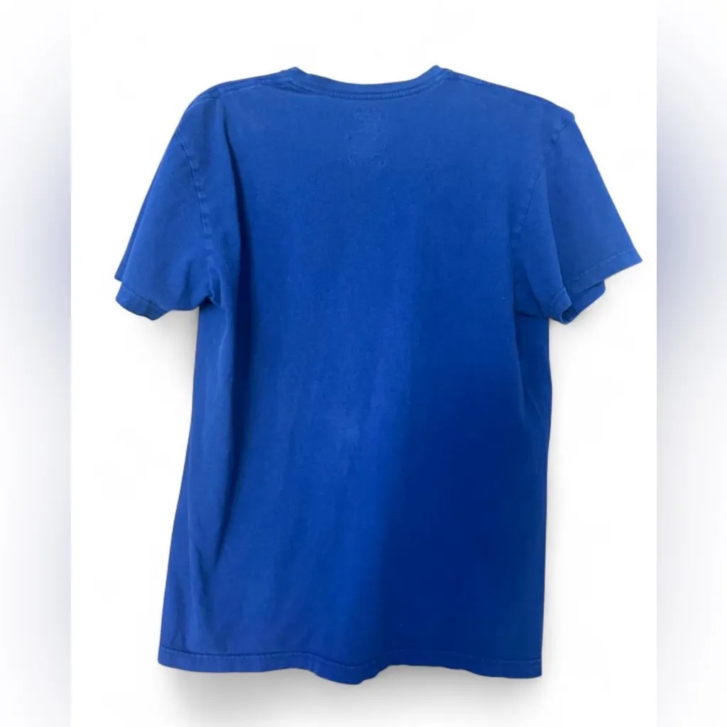 Blue V-Neck Polo Shirt with Pink Logo Classic Fit, Likely Women’s/Unisex Medium - Image 2