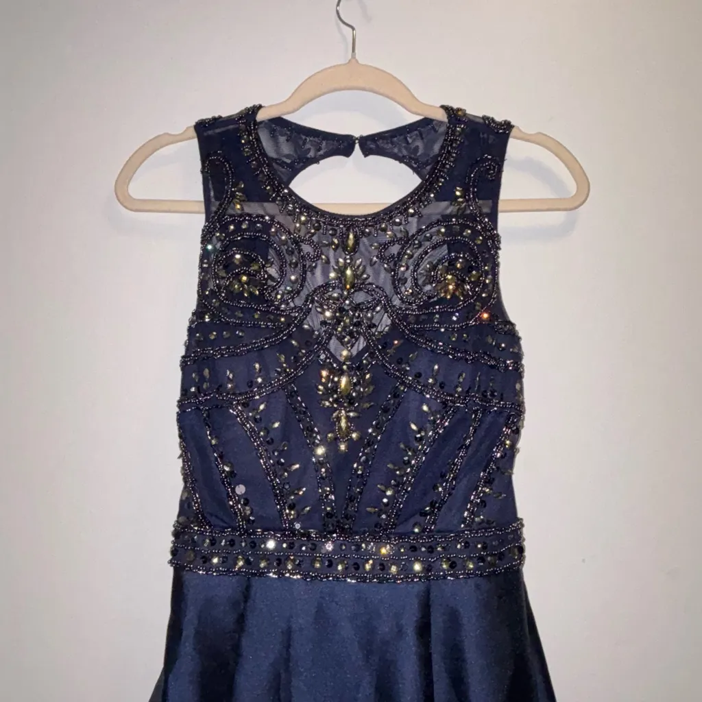 Xscape Beaded Open-Back
Mermaid Halter Royal Blue Gown - Image 5