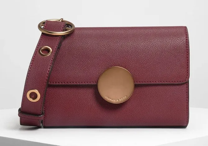 NWT Charles & Keith Burgundy Circular Push Lock Crossbody Bag - Image 1