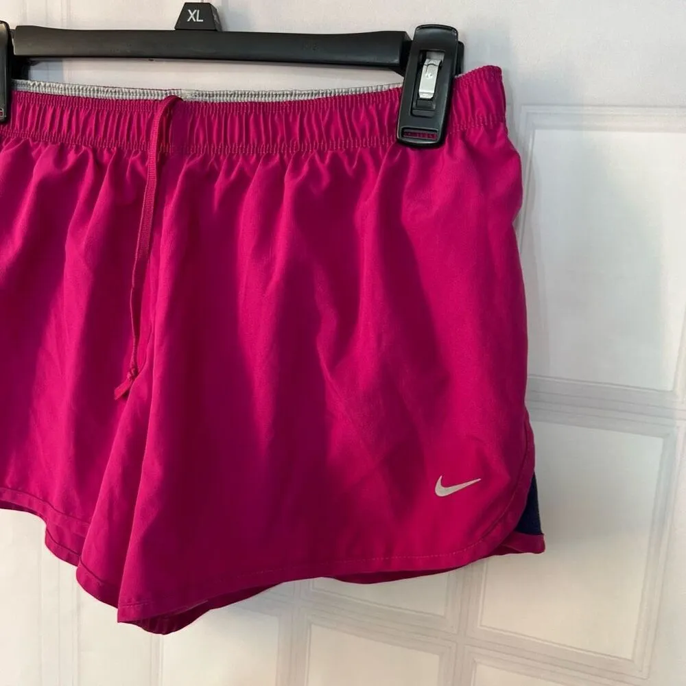 Nike dri-fit magenta lined running shorts size medium - Image 3
