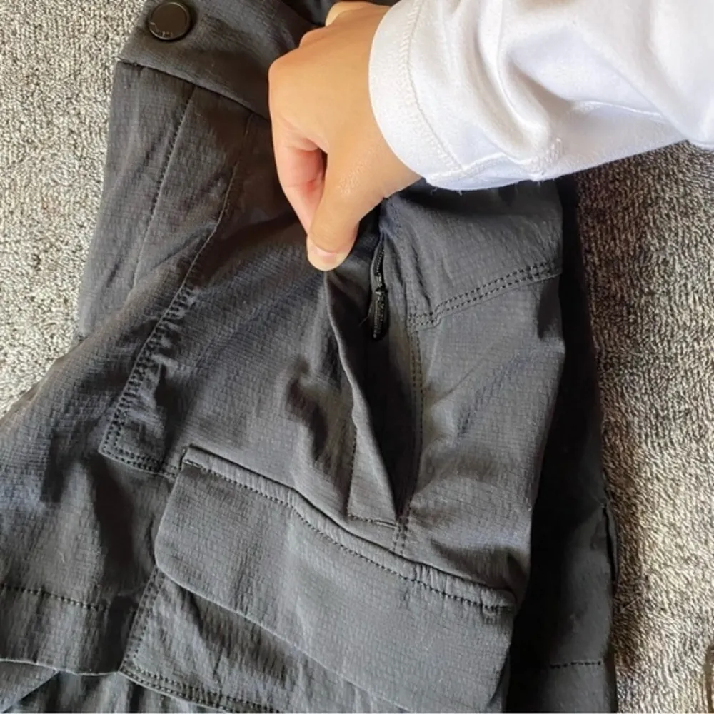 NWOT Athleta matte black shorts with‎ multiple zipper & button pockets - Image 9