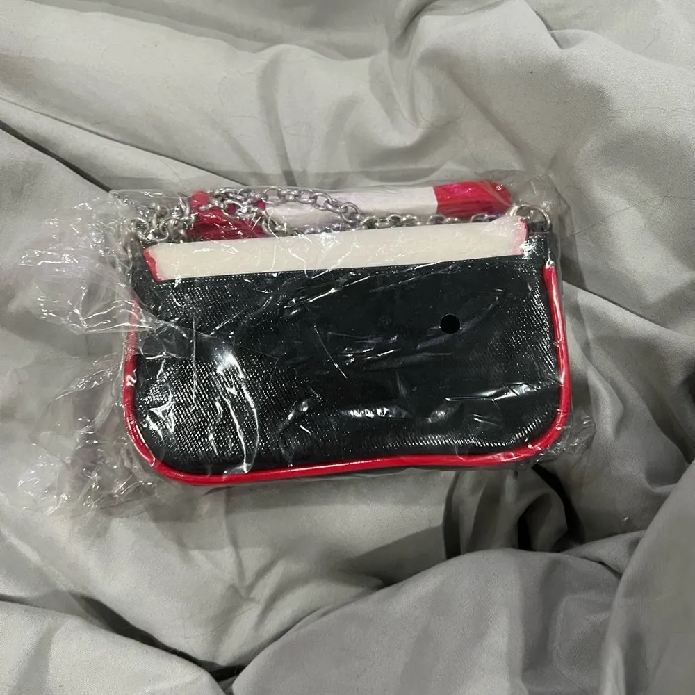 Brighton Red and Cream Clutch with Heart Design - Image 4