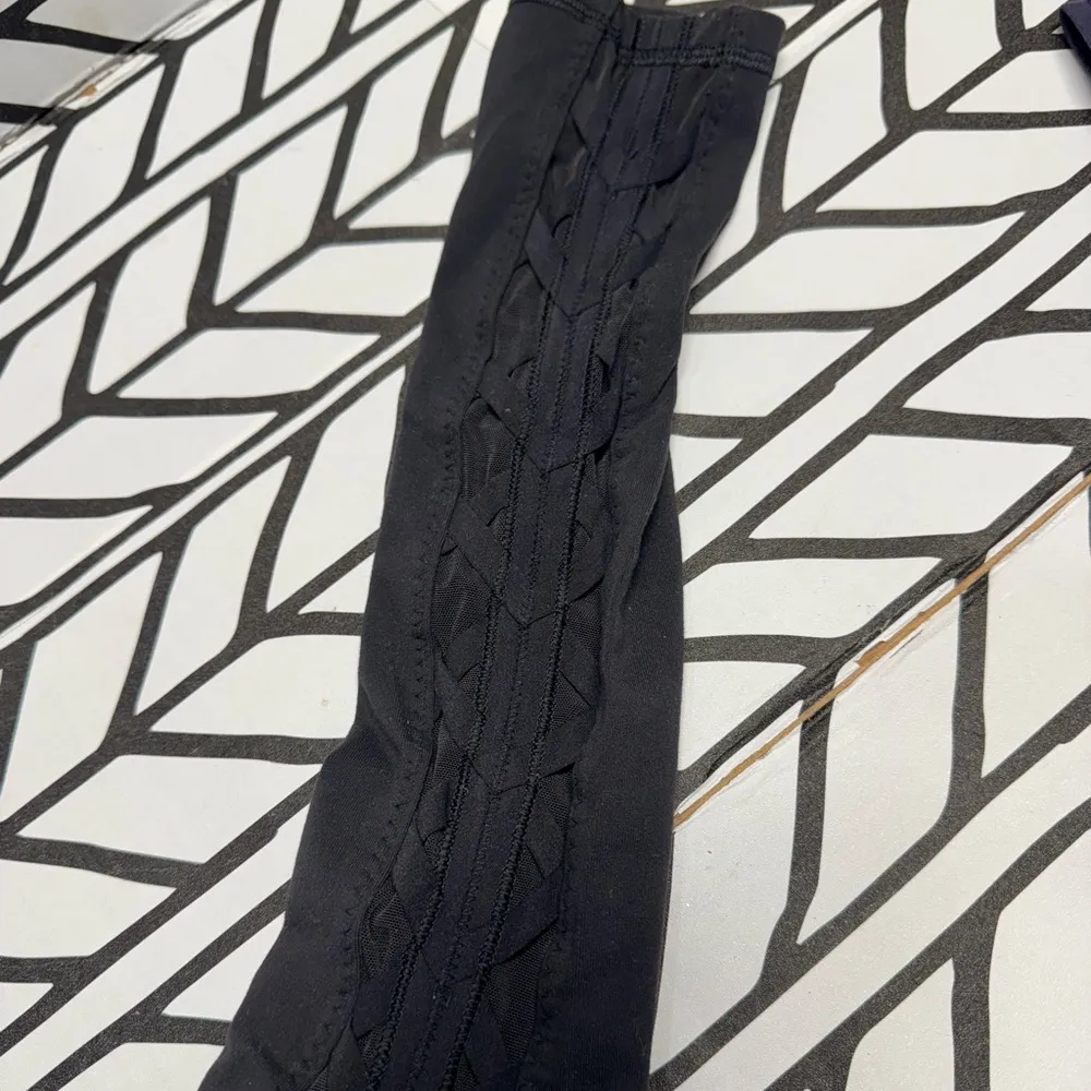 Lululemon Black Leggings with Sheer side panels with Criss Cross details- size 2 - Image 2