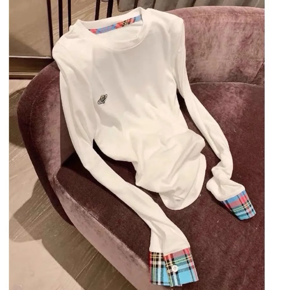 white long sleeve tshirt with plaid cuff and little Saturn embroidery - Image 3