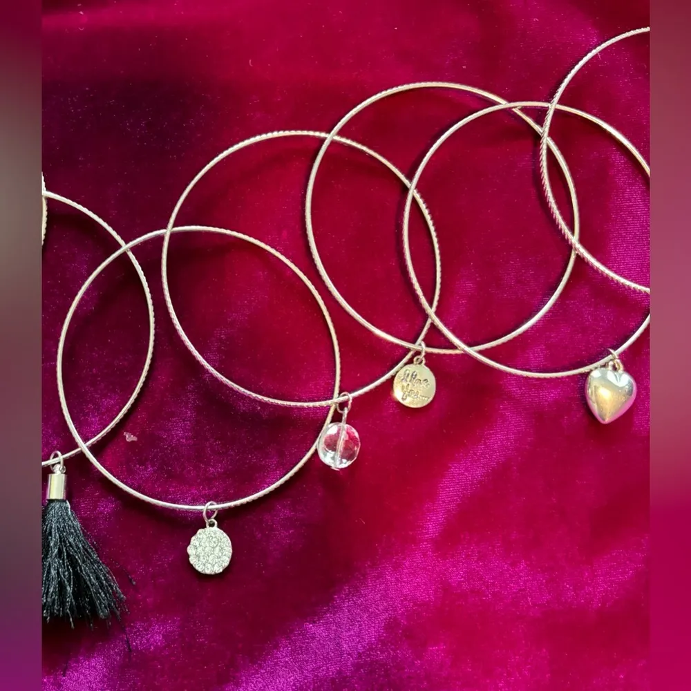 7 Silvertone Bundle of Bracelets with Charms - Image 3