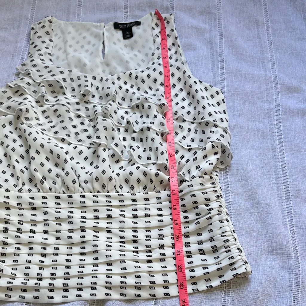 White House Black Market Sleeveless Blouse with Diamond Print and Ruffle Detail. - Image 13