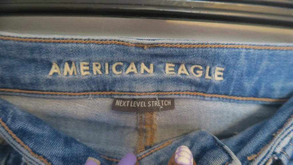 American Eagle Outfitters next level stretch super hi-rise flare jeans in medium wash blue size 4. - Image 8