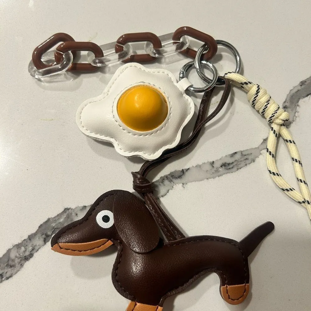 Brown Dachshund Keychain with Egg Charm
Faux leather - Image 4