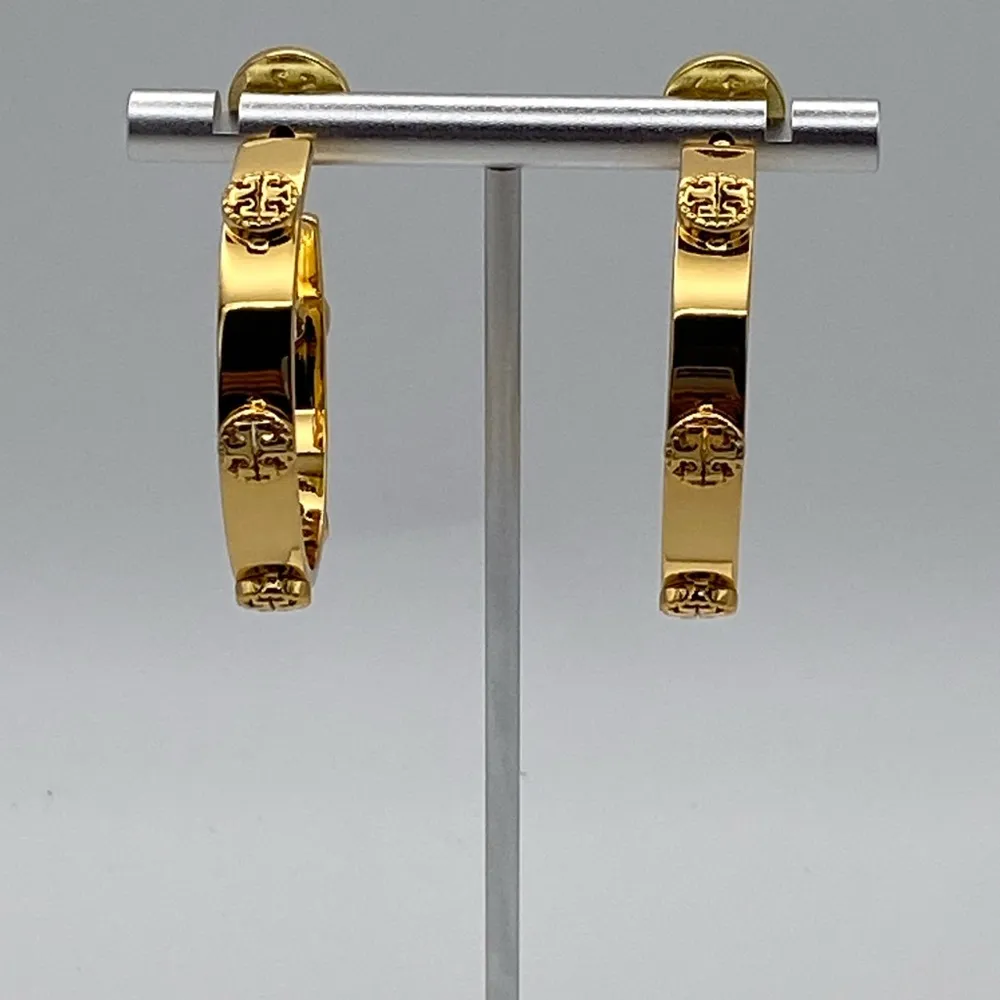 Tory Burch large gold tone hoops with iconic double T logo. - Image 4