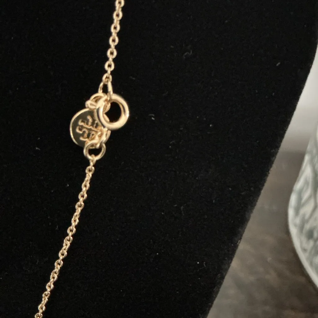 Brand new Tory Burch gold logo pendant necklace, new on card and never worn. - Image 4