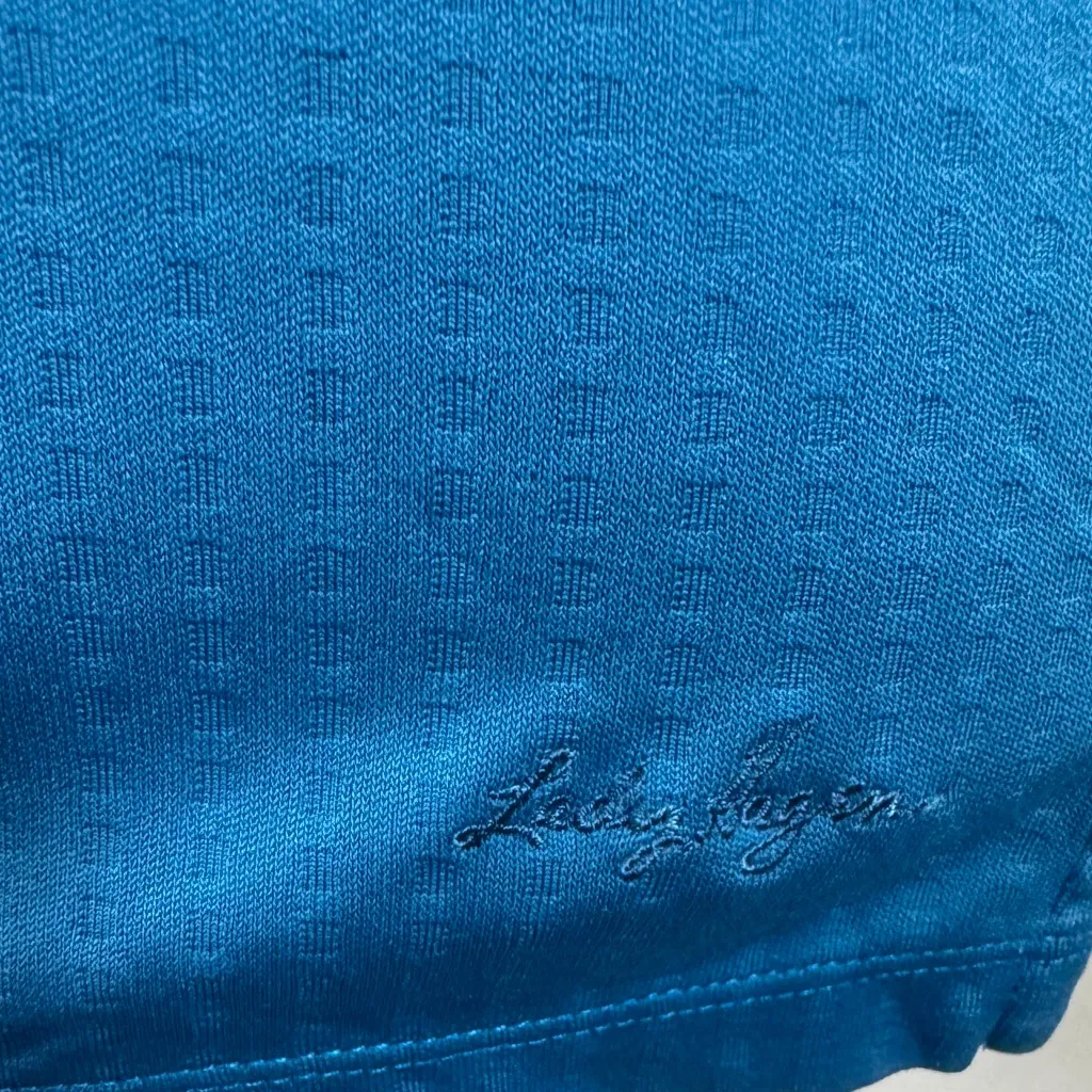 Lady Hagan blue textured and branded hydro dri gold polo size large - Image 4