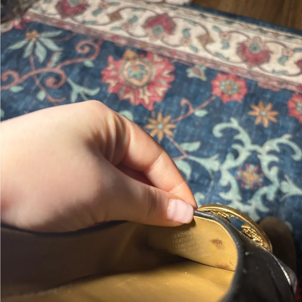 Tory Burch Black and Tan flats with Gold Emblem - Image 3