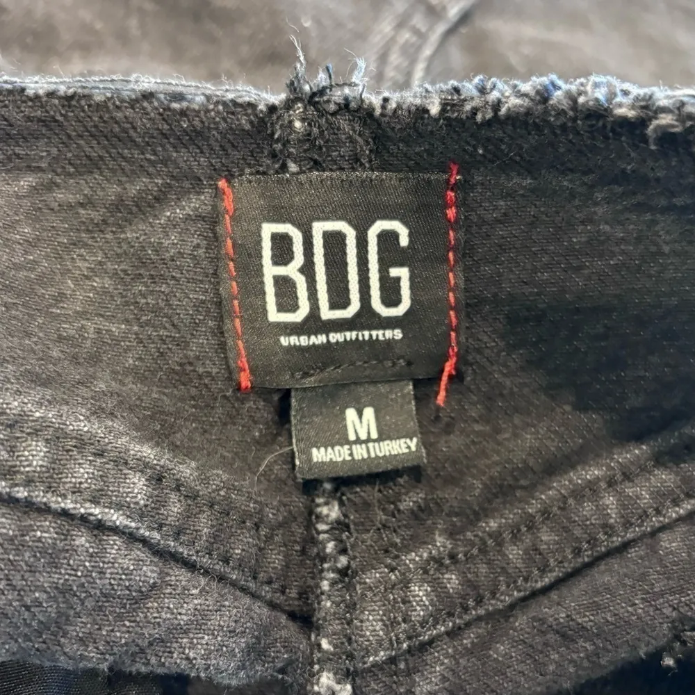 Women’s BDG Urban Outfitters black distressed denim cut off mini skirt size med - Image 9