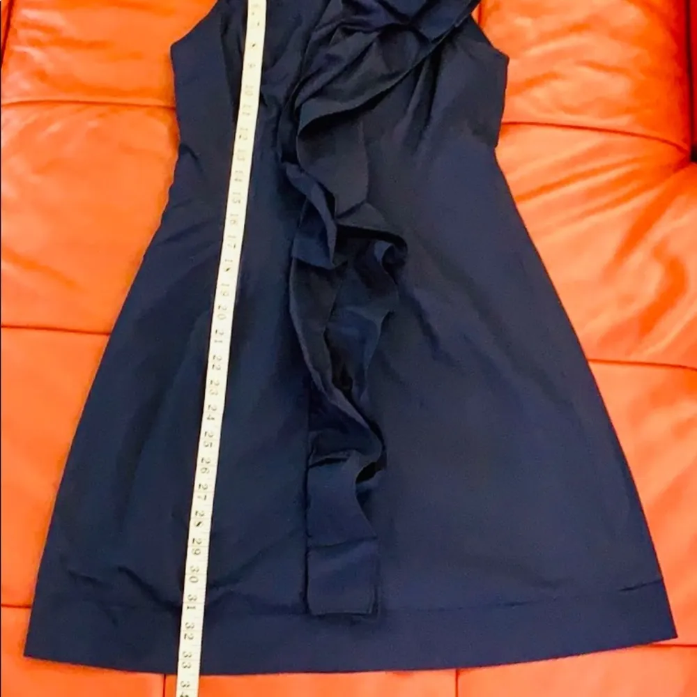 Navy blue sleeveless ruffled collar mini dress. - Image 8