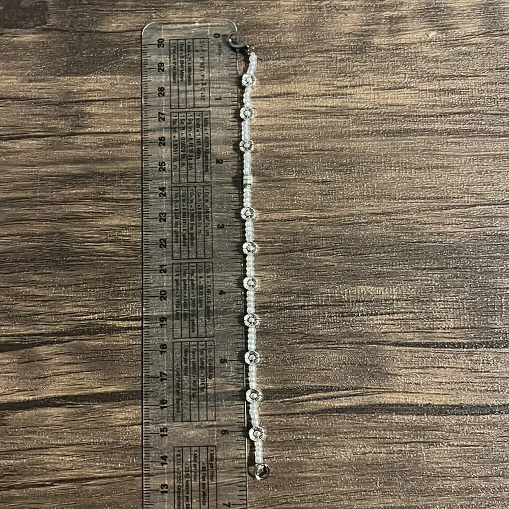 Beaded bracelet with clear and flower beads for size small/medium wrist. 6.5 in. - Image 2