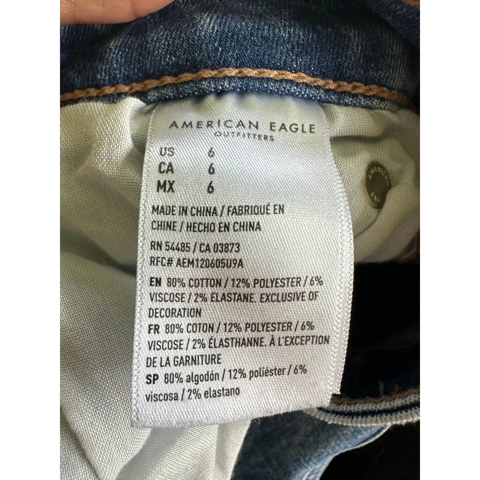 American Eagle Stretch Hi-Rise Light Wash Distressed Raw Edge Folded Hem Shortie - Image 6