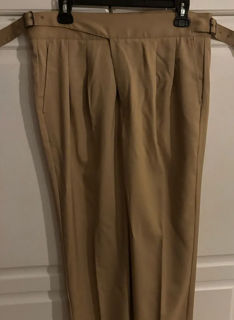 Timeless form tan pants. Buckles on waist. Tan Size 28