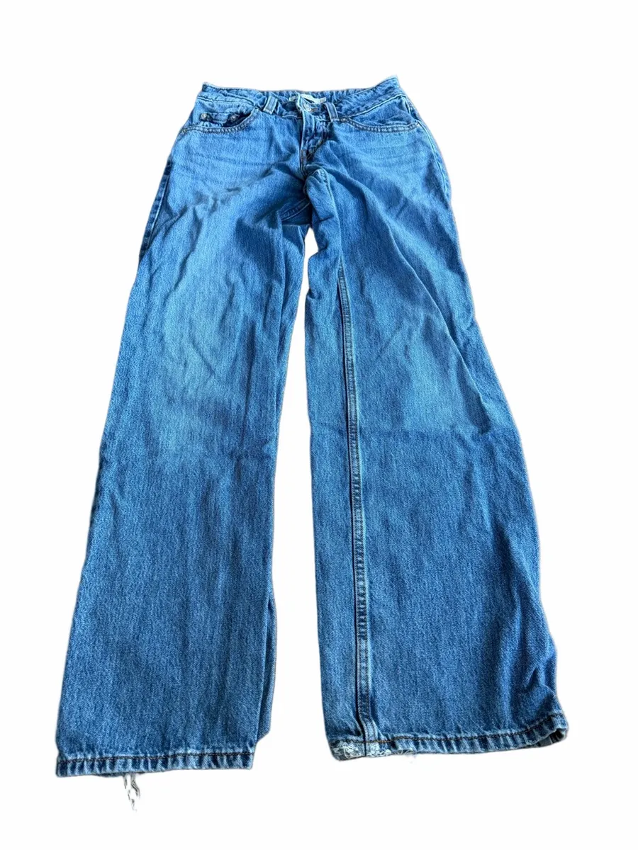 Levi's light blue denim jeans with tan leather patch