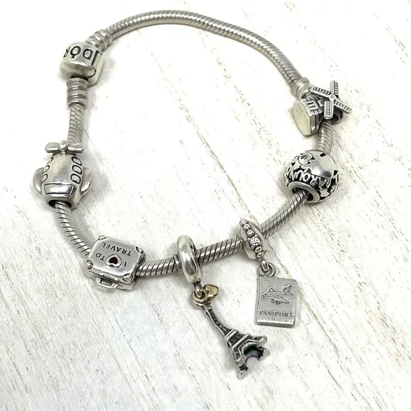 PANDORA “travel” themed 6 charm sterling silver bracelet